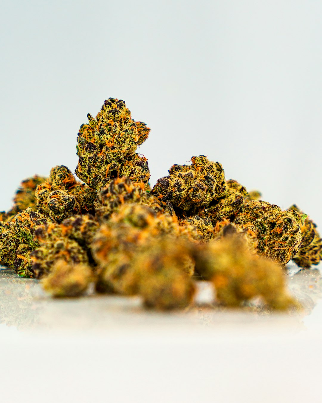 a-pile-of-yellow-weed-sitting-on-top-of-a-white-table-ubtr9vsd-dk